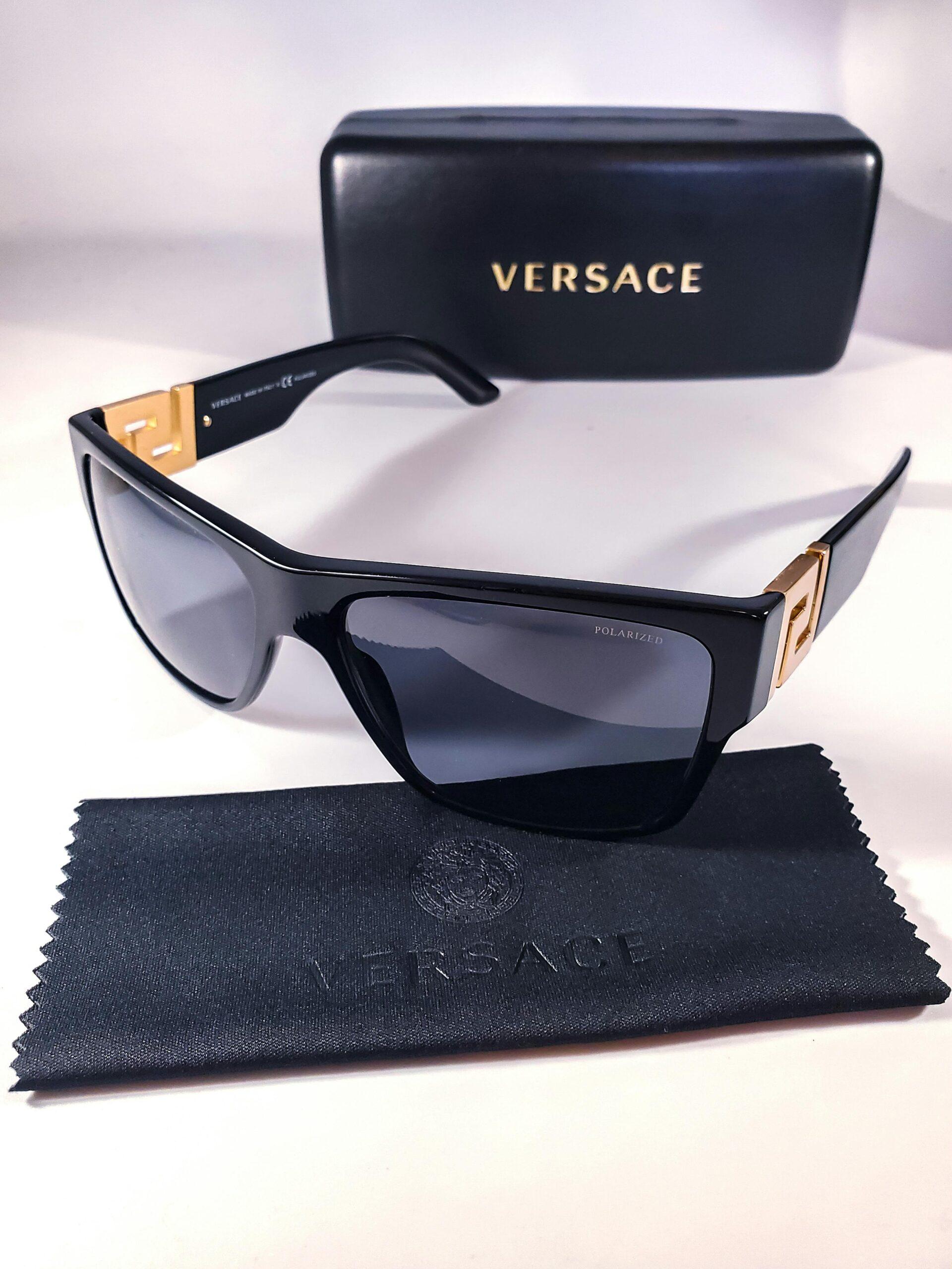 Elegant Versace sunglasses with gold accents, styled for luxury fashion lovers.